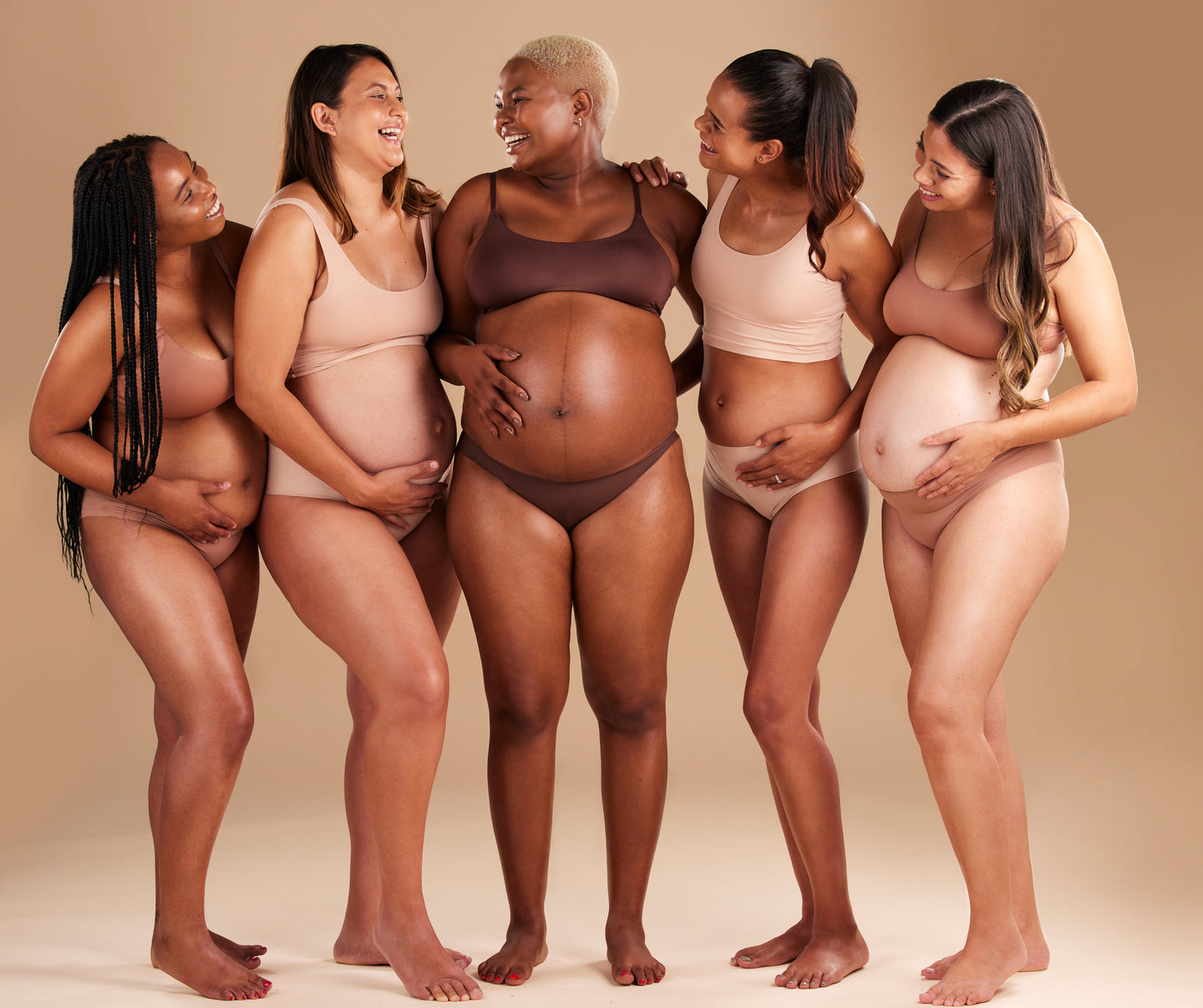 Group of pregnant women happy enjoying pregnancy.